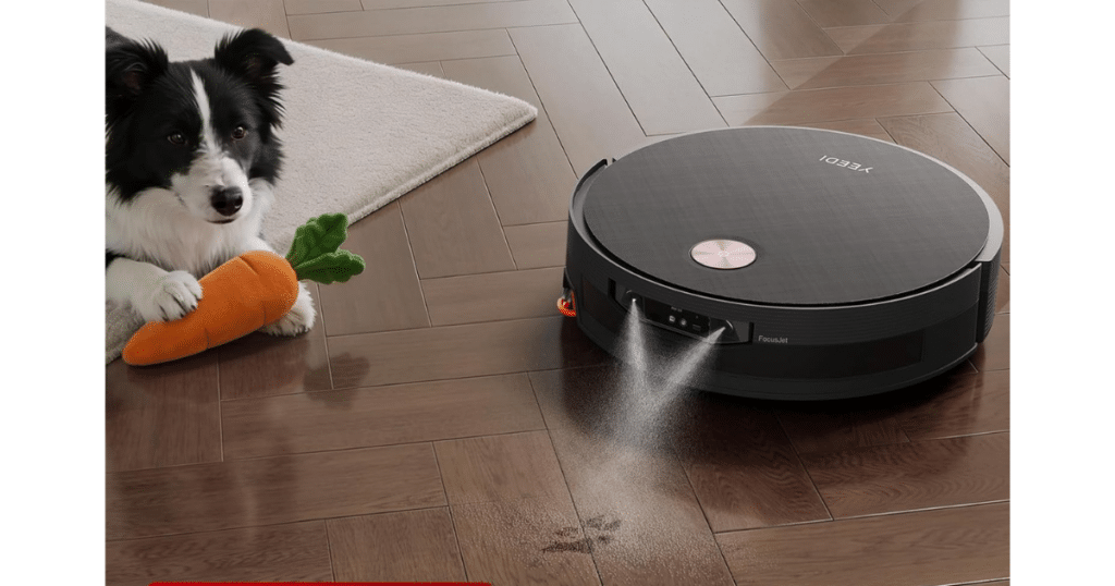 Yeedi S20 Infinity Ultra focusjet | Vacuum Wars Yeedi S20 Infinity Ultra robot vacuum spraying water mist with FocusJet stain pre-dissolving technology on hardwood floors beside a dog holding a carrot toy