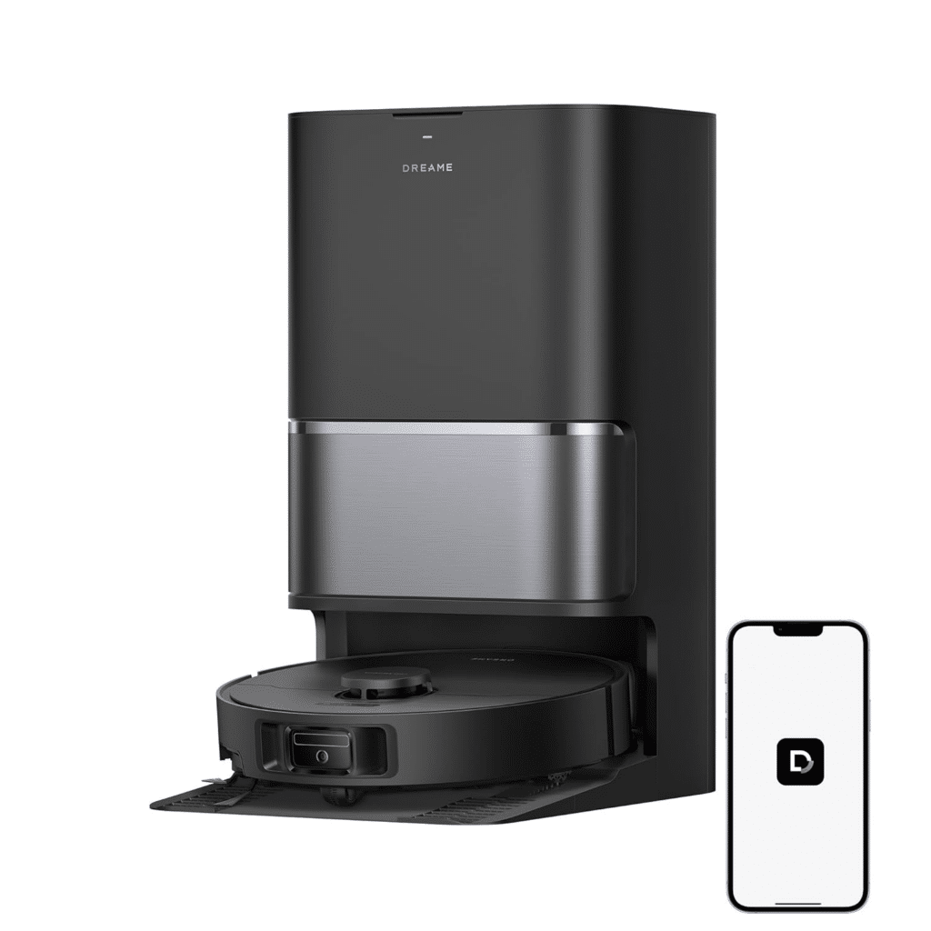 image | Vacuum Wars Sleek black Dreame robot vacuum on its charging dock beside a smartphone showing the app icon.