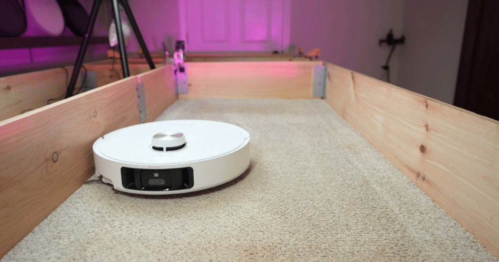 Dreame L60 Ultra PE Carpet Deep Clean Test at the Vacuum Wars studio | Vacuum Wars Dreame L60 Ultra PE robot vacuum on carpet during Vacuum Wars’ carpet deep-cleaning test