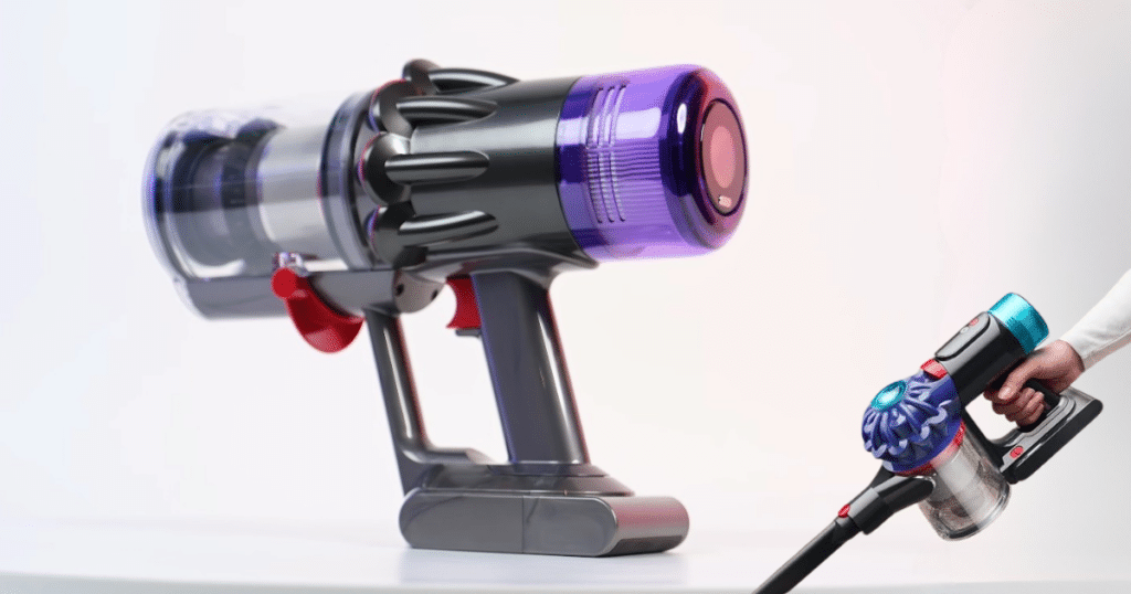 Dyson V9 Motorbar Form | Vacuum Wars Cordless handheld vacuum on a white surface with a large purple canister and red trigger tail attached to its stand.