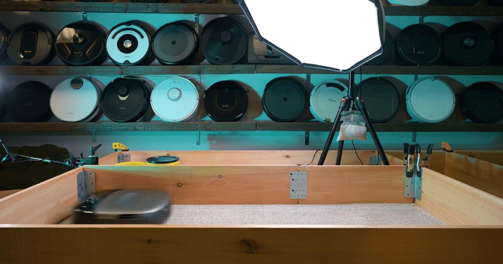 Eufy Omni S2 carpet deep clean | Vacuum Wars Eufy Omni S2 robot vacuum performing the Vacuum Wars carpet deep clean test, where it removed 87% of embedded sand from medium-pile carpet, outperforming the studio average of 82.2% and the previous S1 Pro's 61%.