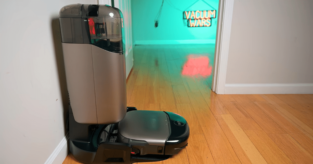 Eufy Omni S2 dock | Vacuum Wars Eufy Omni S2 robot vacuum docked in the UniClean multifunction station. The vertical dock uses a compact footprint while positioning the clean and dirty water tanks higher for easier access and maintenance.