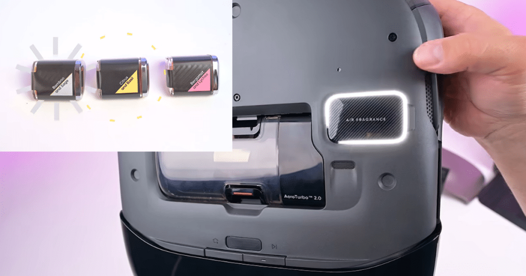 Eufy Omni S2 fragrance | Vacuum Wars Close-up of the Eufy Omni S2 robot vacuum showing its built-in Air Fragrance compartment and optional fragrance cartridges. The robot supports three interchangeable scent cartridges that release fragrance while cleaning.
