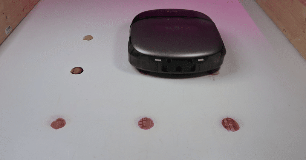 Eufy Omni S2 mop test | Vacuum Wars Eufy Omni S2 robot vacuum performing the Vacuum Wars dried stain mopping test. The robot scored 82 points, about 20% below the studio average and well below the original S1 Pro's stain removal performance.