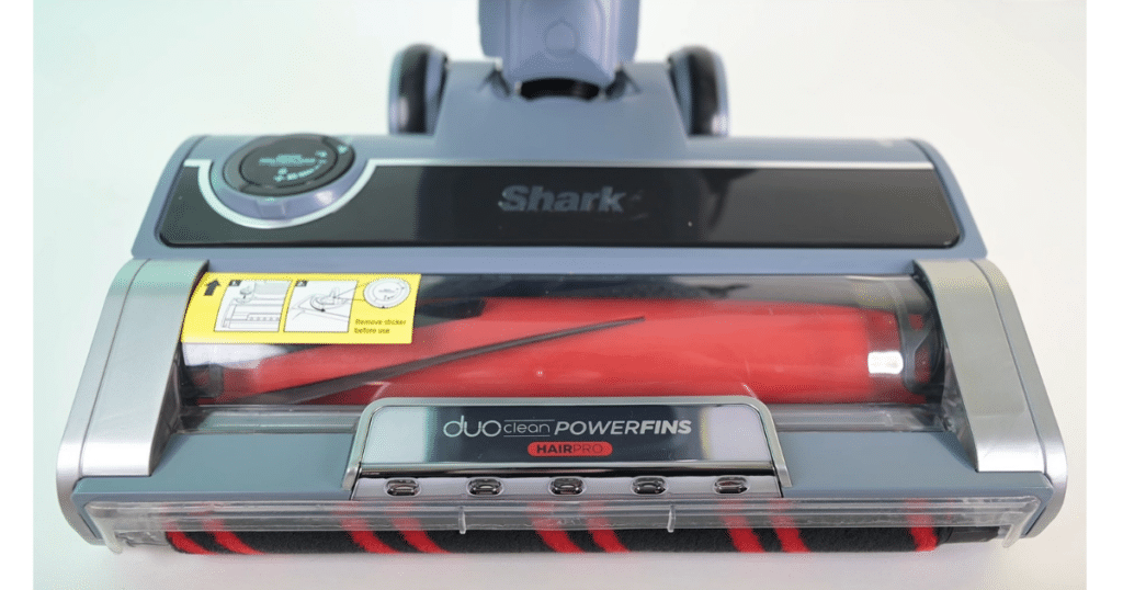 Close-up of the Shark  Performance Powered Lift-Away UV2500 floorhead showing DuoClean PowerFins HairPro technology with a dual-brushroll system designed for hard floors, carpets, and hair pickup.
