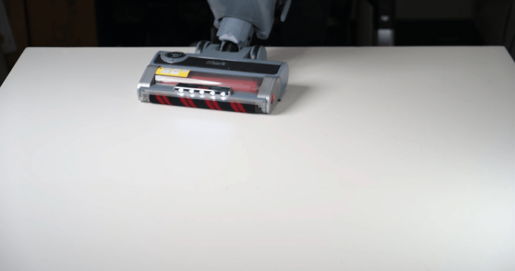 The Shark Performance Powered Lift-Away upright vacuum successfully vacuuming fine debris on a hard floor