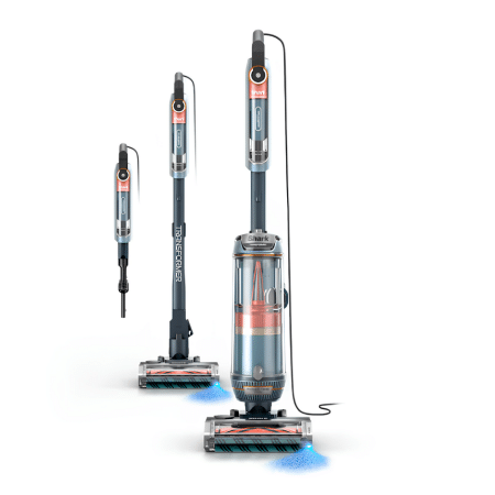 Shark PowerDetect Transformer 450 | Vacuum Wars A family of Shark cordless stick vacuums in blue and gray, including handheld and upright models, shown standing ready to clean.