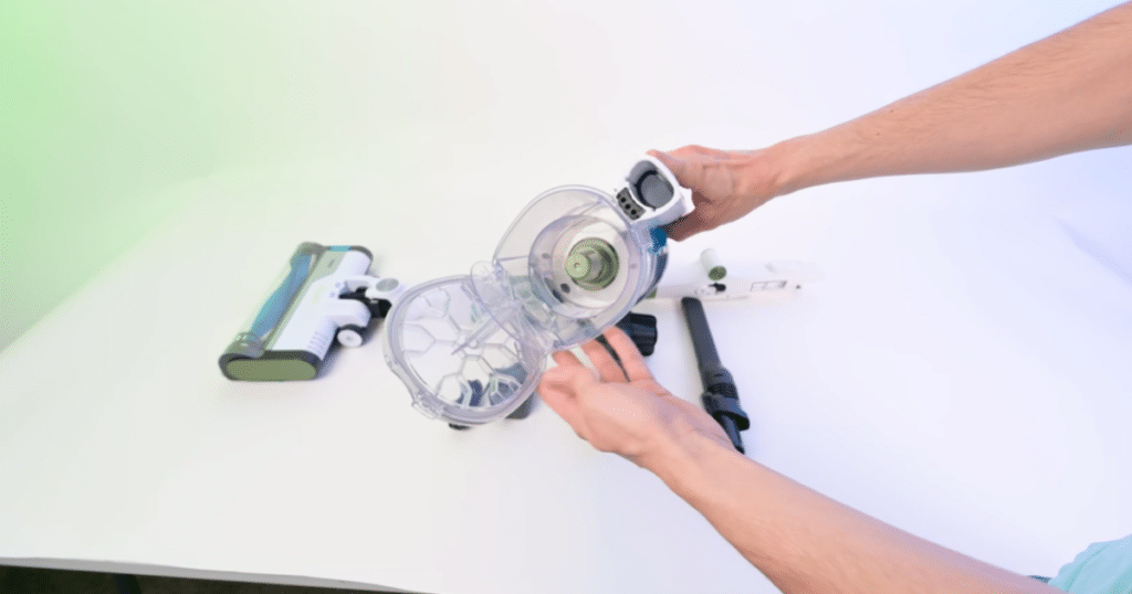 Shark PowerPro Flex Pet Dustbin | Vacuum Wars Open dustbin assembly on the Shark PowerPro Flex Pet Plus cordless vacuum, showing the bin design and emptying mechanism.
