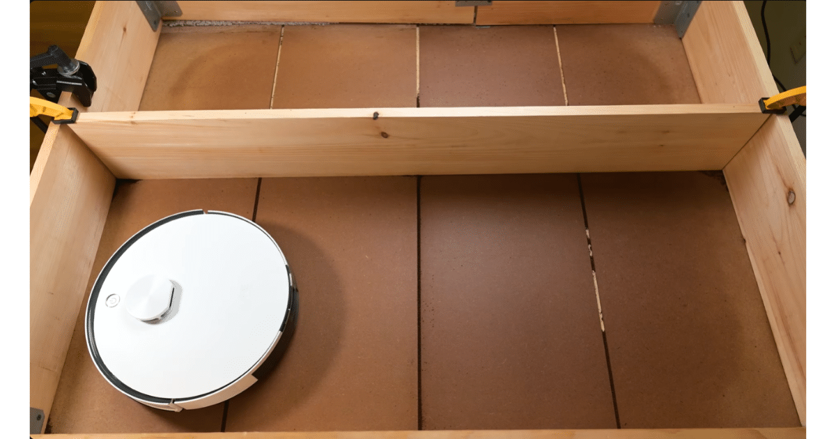 Crevice pickup test showing the iLife A30 Pro navigating a floor with narrow gaps designed to evaluate debris removal from crevices.