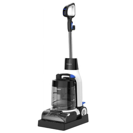 image | Vacuum Wars Upright vacuum cleaner with a transparent dirt canister, long wand, and detachable handheld head at the top.