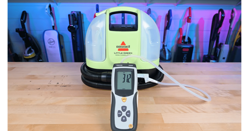 Bissell Little Green Mini Cordless spot cleaner Suction Vacuum Wars | Vacuum Wars Bissell Little Green Mini Cordless connected to a digital pressure meter during a Vacuum Wars suction evaluation.