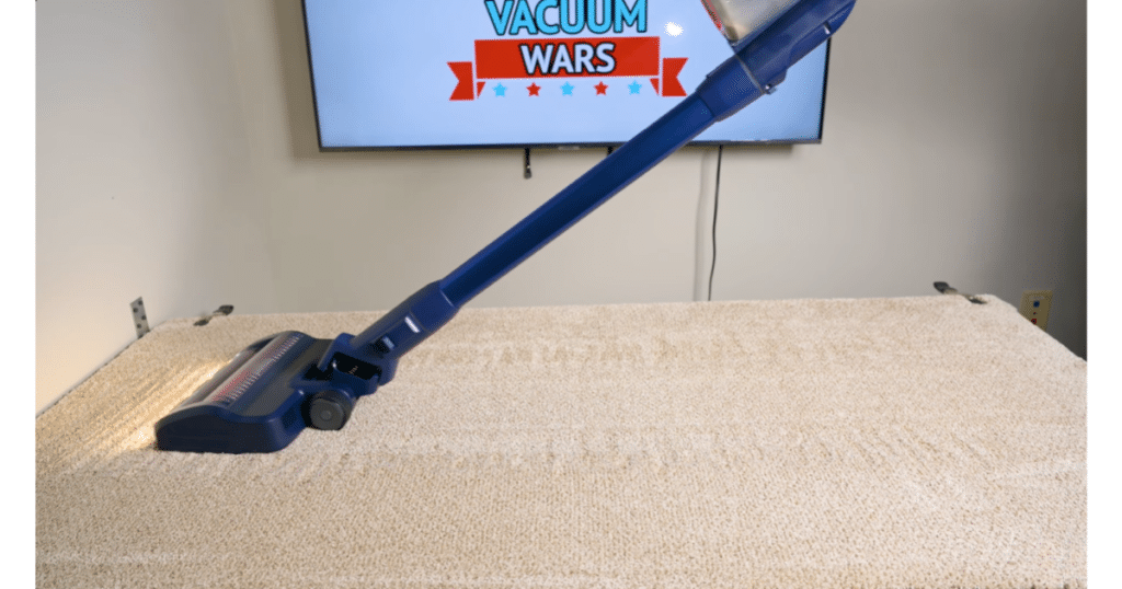 Bissell PowerClean DualBrush Carpet Deep Clean test at Vacuum Wars | Vacuum Wars Bissell PowerClean DualBrush cordless vacuum cleaning medium-pile carpet during Vacuum Wars’ embedded sand test.