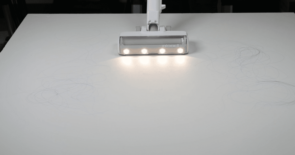 Bissell Powerclean Cordless Vacuum 4173 Hair Test at Vacuum Wars 2 | Vacuum Wars A cordless vacuum with floorhead lights successfully vacuuming hair on a hard floor.