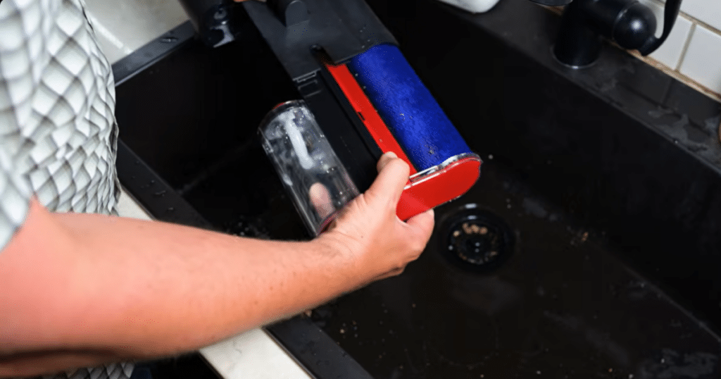 Dyson V16 Piston Animal Submarine Head Water Tank Vacuum Wars 1 | Vacuum Wars Dyson V16 Submarine wet-cleaning head being emptied and rinsed in a sink after mopping.