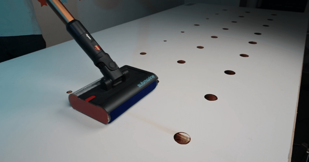 Dyson V16 Piston Animal Submarine Mopping Tests 1 Vacuum Wars | Vacuum Wars Dyson V16 Piston Animal Submarine wet-cleaning head removing dried stains from a white hard-floor test surface.