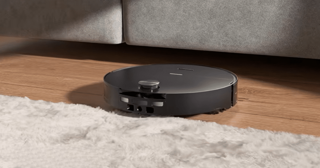 Roborock Saros 20 Sonic lidar | Vacuum Wars Roborock Saros 20 Sonic with its retractable LiDAR lowered to clean beneath low furniture.