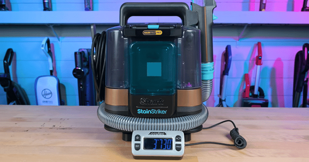 Shark StainStriker weight | Vacuum Wars Shark StainStriker HairPro on a digital scale during Vacuum Wars testing. The portable spot cleaner weighs 3,730 grams (8.2 pounds), compared with the category average of 4,354 grams (9.6 pounds).