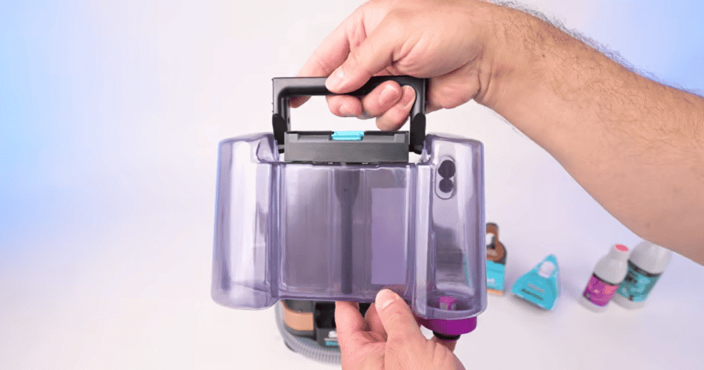 Shark StainStriker tank size | Vacuum Wars Shark StainStriker HairPro clean water tank removed during Vacuum Wars testing. The tank holds 41 ounces of clean water, compared with the 48.8-ounce category average for portable spot cleaners.