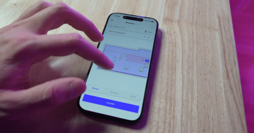 Shark vulnerability map | Vacuum Wars Smartphone displaying the SharkClean app with a home map and cleaning controls for a Shark robot vacuum.