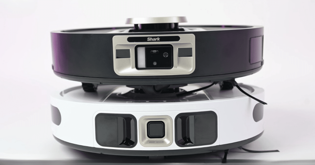 Shark vulnerability robots | Vacuum Wars Shark robot vacuums with front-facing cameras and LiDAR navigation shown stacked together.