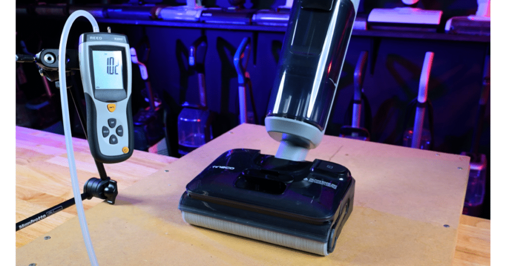 Tineco Floor One i5 Stretch Usable Suction Vacuum Wars | Vacuum Wars Tineco Floor One i5 Stretch floorhead connected to a suction gauge during Vacuum Wars’ usable-suction evaluation.
