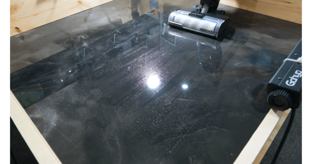 Tineco Floor One i5 Stretch Water Recovery Test Vacuum Wars | Vacuum Wars Tineco Floor One i5 Stretch cleaning a glossy test floor during the water-recovery and residual-moisture evaluation.