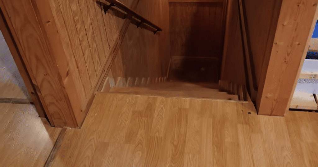 Narwal Flow 2 Home stairs | Vacuum Wars Staircase at the edge of a hardwood floor where the Narwal Flow 2 approached closely during its initial home mapping run.