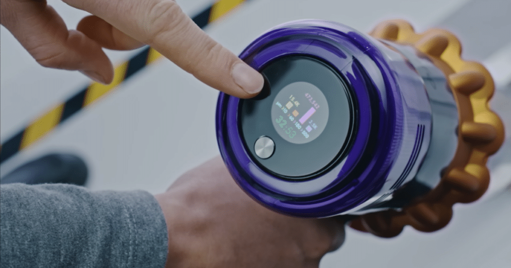 Particle Collection Display Score Vacuum Wars | Vacuum Wars Dyson cordless vacuum LCD particle display showing real-time debris detection information during cleaning.