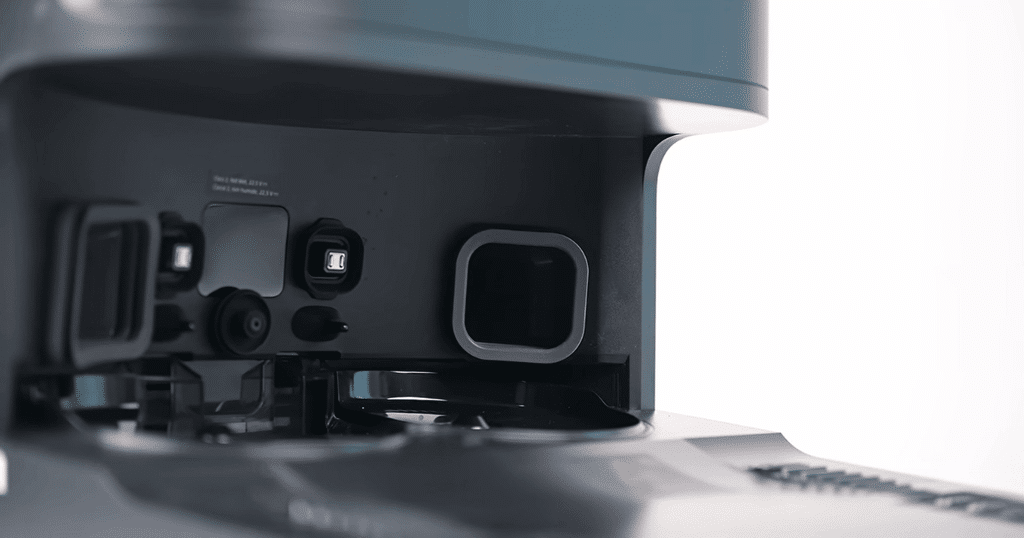 Robot buyer guide dock features | Vacuum Wars Close-up of a full-service robot vacuum dock with automated mop washing, drying, and water management features.