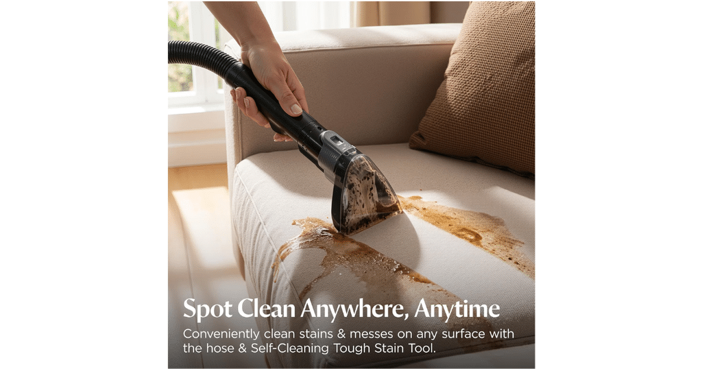 Bissell Revolution ExpressClean Spot Cleaning | Vacuum Wars A person uses the BISSELL Revolution ExpressClean’s hose and Tough Stain Tool to clean a stain on a sofa cushion.