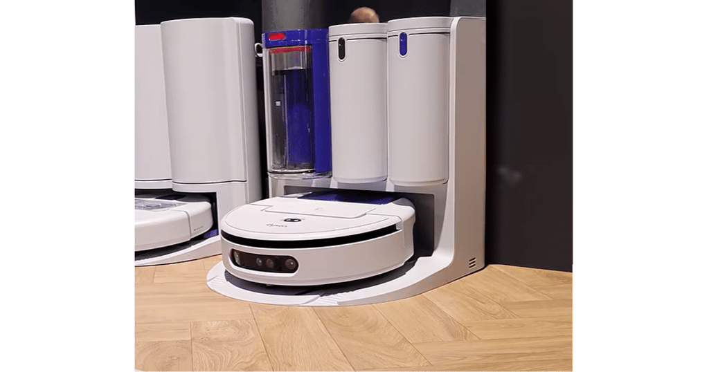Dyson Nurovi R3 on display at IFA 2026 | Vacuum Wars Dyson R3 Nurovi Spot+Scrub UV robot vacuum positioned in its self-emptying dock on a hard floor.