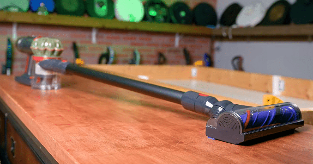 Dyson V8 Cyclone cordless vacuum displayed on a workbench at the Vacuum Wars studio. | Vacuum Wars Dyson V8 Cyclone cordless vacuum displayed on a workbench at the Vacuum Wars studio.