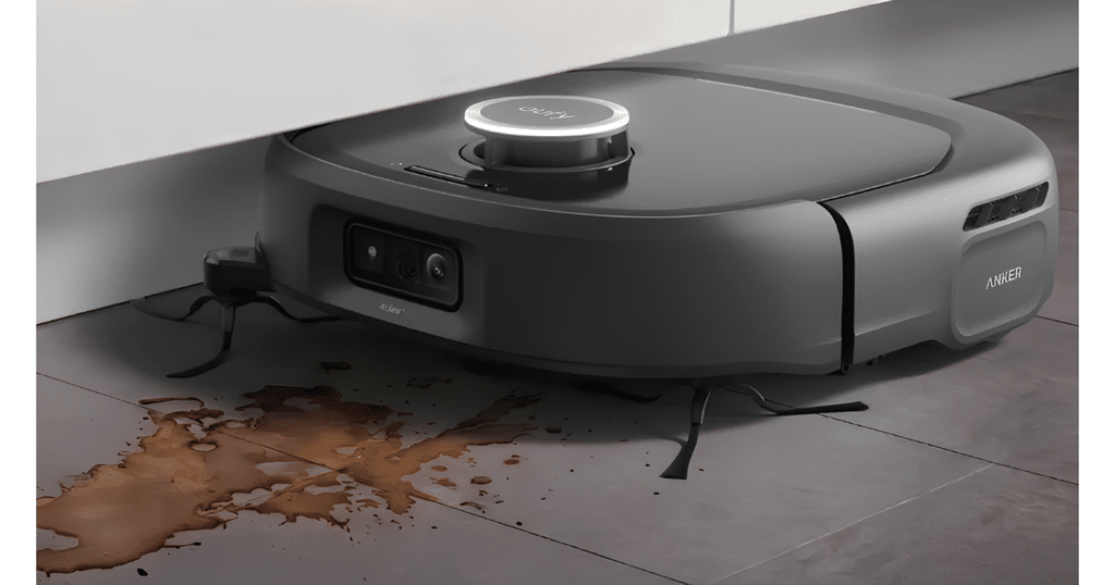 Eufy Omni E35 Robot Vacuum on hard floor | Vacuum Wars Anker robotic vacuum on a tiled floor beside a brown spill on the ground.