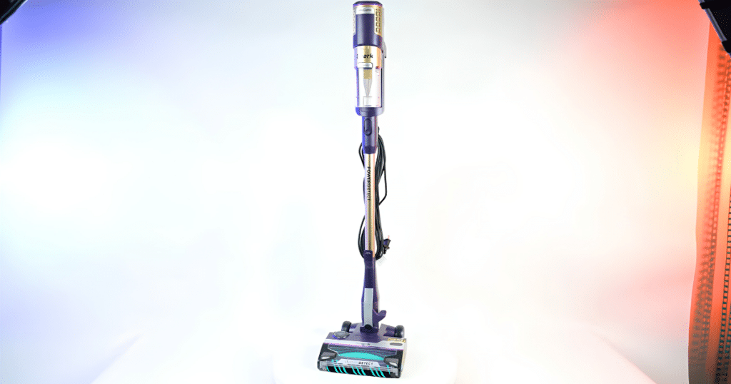 Shark PowerDetect UltraLight HZ4002 Corded Stick Vacuum | Vacuum Wars Shark PowerDetect UltraLight HZ4002 corded stick vacuum standing upright in the Vacuum Wars studio.