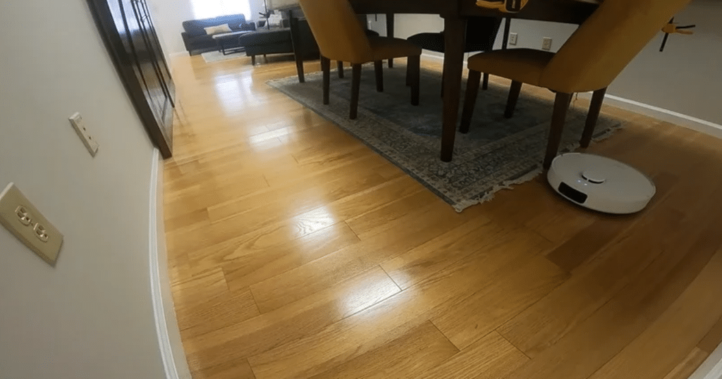 Dreame D20 Plus Navigation at Vacuum Wars | Vacuum Wars Dreame D20+ navigating around dining room furniture during Vacuum Wars testing.