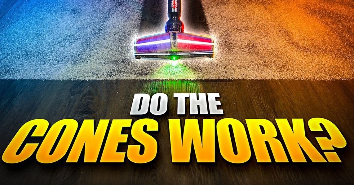 | Vacuum Wars Dyson V10 Konical cleaner head positioned between carpet and hard flooring, with green floor illumination. Large yellow and white text reads “DO THE CONES WORK?”