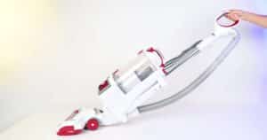 Shark Rotator NV501 Review Hero | Vacuum Wars White and red Shark Rotator Lift-Away NV501 reclined on a white studio floor.