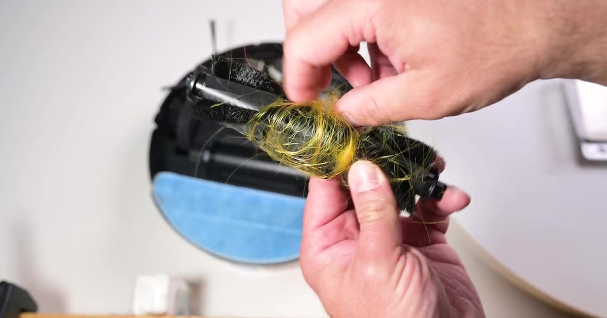 Tikom G8000 Max hair tangle | Vacuum Wars Long hair wrapped around the Tikom G8000 Max brushroll after our hair-tangle test.